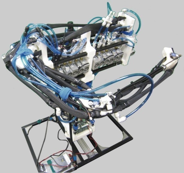 A close-up of a robotic arm that shows its inner parts, wiring, and design.